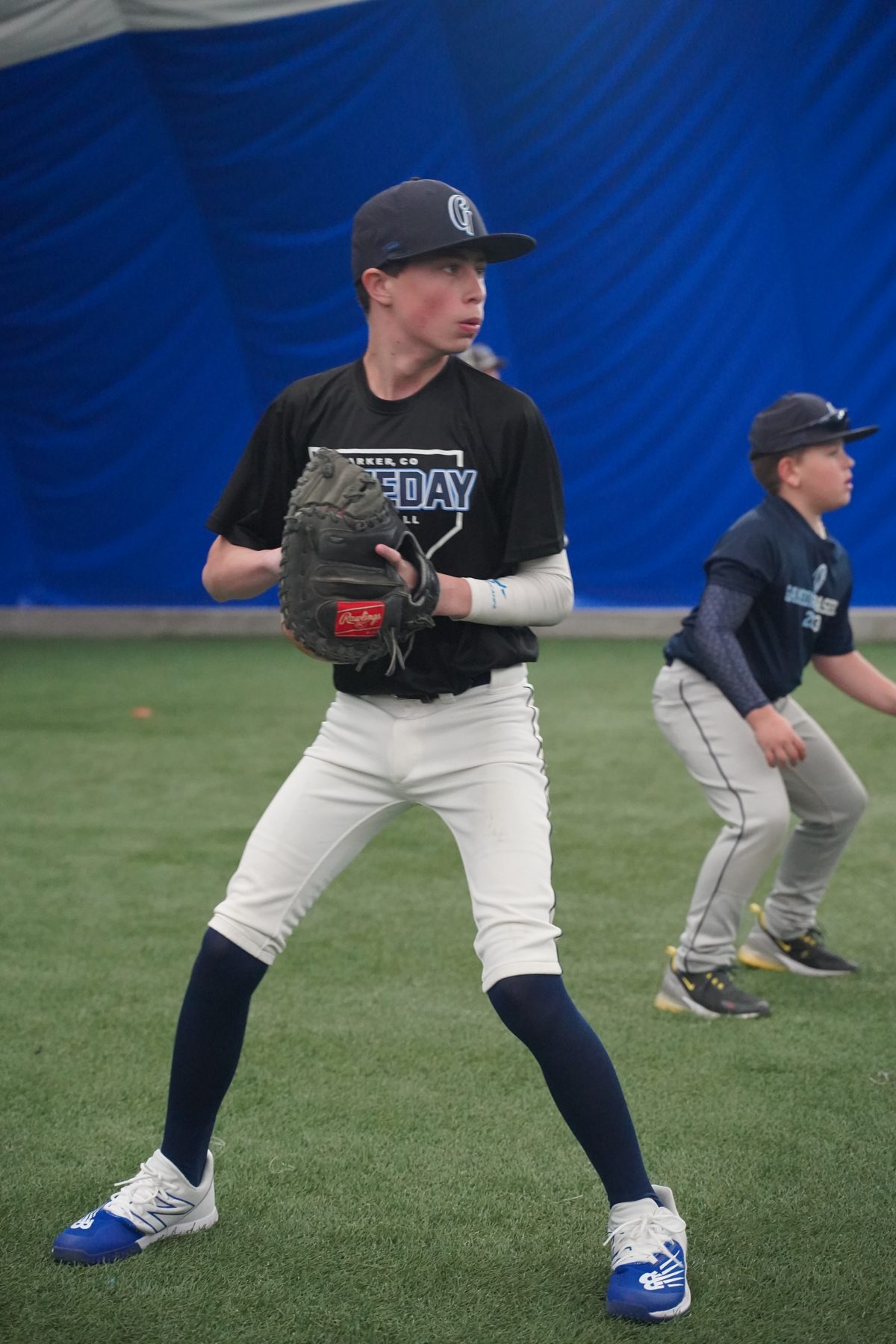 Youth Gameday player in fielding ready position